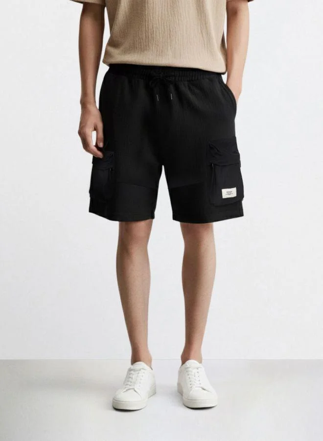 The Indian Garage Co Men Relaxed Fit Solid Cargo Pocket Mid-Rise Cargo Shorts
